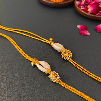 Gold Cowrie Dori Rakhi set of 2