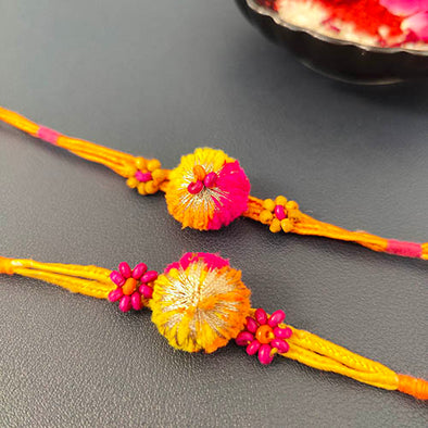 Pink/Orange Pom-pom Wooden Beads Rakhi (set of 2)