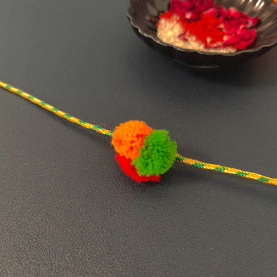 Ladoo Yellow/ Green Pom Pom Traditional Adult Rakhi