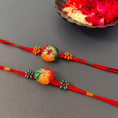 Red/Green Pom-pom Wooden Beads Rakhi (set of 2)