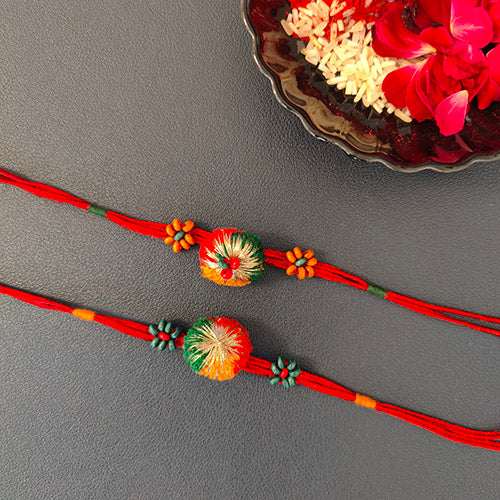 Red/Green Pom-pom Wooden Beads Rakhi (set of 2)