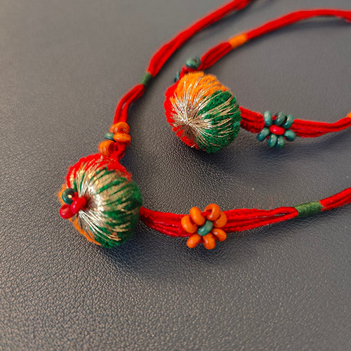 Red/Green Pom-pom Wooden Beads Rakhi (set of 2)