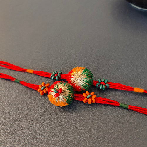 Red/Green Pom-pom Wooden Beads Rakhi (set of 2)